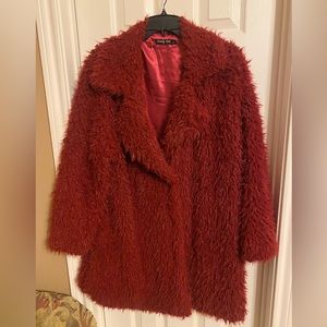 Dark red furry jacket from boutique